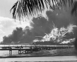 Battleship row burns during the attack on Pearl Harbor