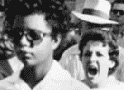 Elizabeth Eckford on her way to school as a white mob follows