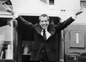 A newspaper headline announces Nixon's resignation